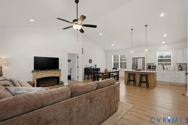 a living room with furniture fireplace and window