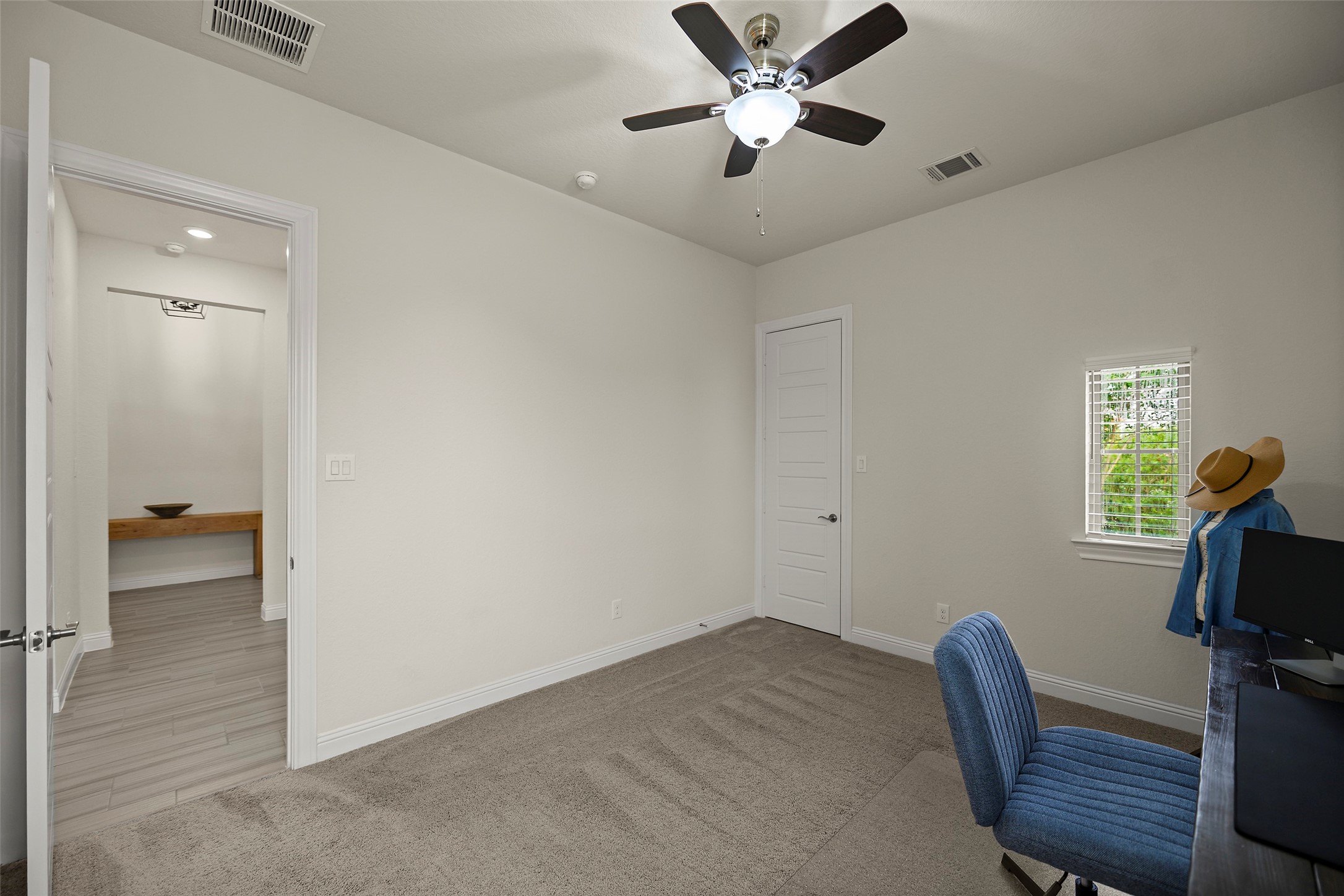 20330 Rosegold Way Spring, TX 77379 - Photo 25 of 48 Spacious secondary bedroom with plush carpeting and ample closet space.