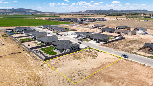 3793 925 North, Unit 13 Cedar City, UT 84721 - Photo 12 of 13 Expansive level lot featuring clear boundaries, direct road frontage, and a partially developed residential setting