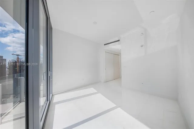 a kitchen with cabinets and white appliances