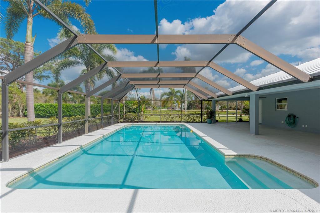 1469 Northwest Fork Road Stuart, FL 34994 - Photo 12 of 39 a view of a backyard