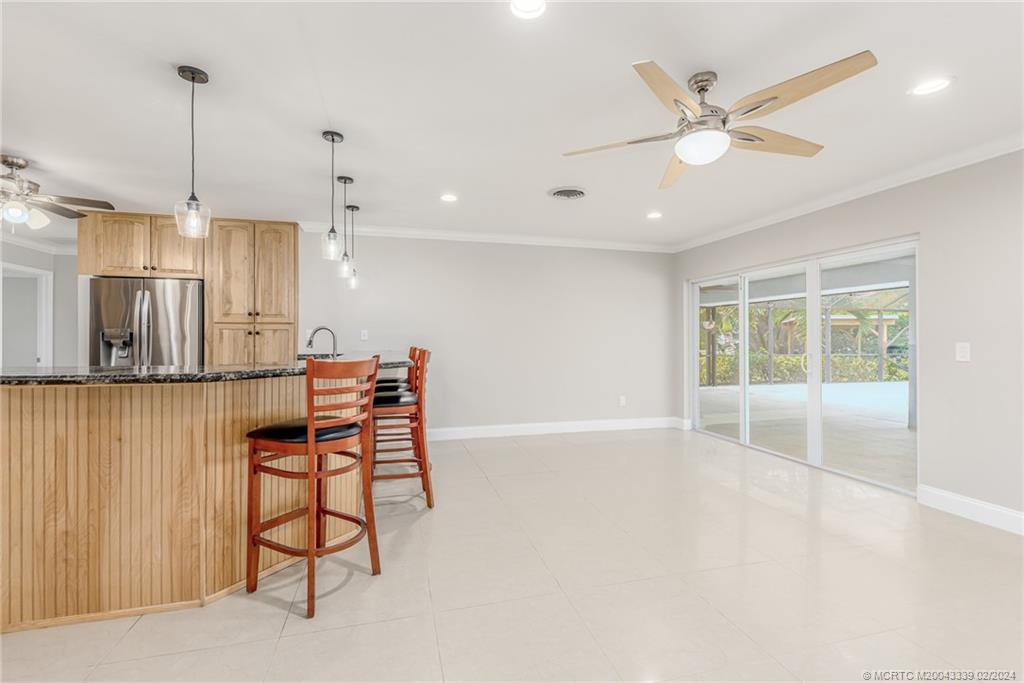 1469 Northwest Fork Road Stuart, FL 34994 - Photo 17 of 39 a view of an empty room with window and chandelier fan