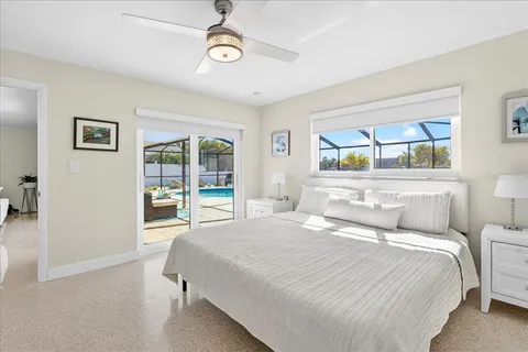 a bedroom with a large bed and a window