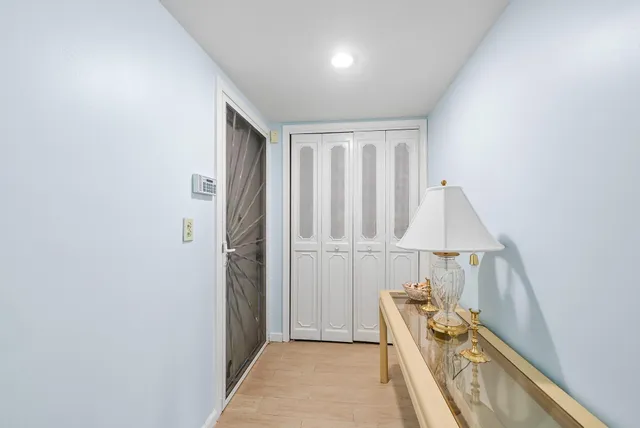 a view of hallway with furniture