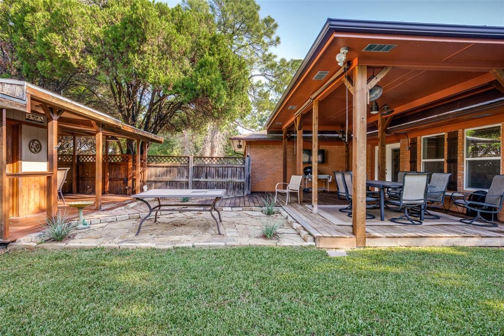 1027 Stanley Street Denton, TX 76201 - Photo 35 of 38 OUTDOOR ENTERTAINING AREA~COVERED DECK & SHOP~DINING AREA~OPEN COURTYARD~