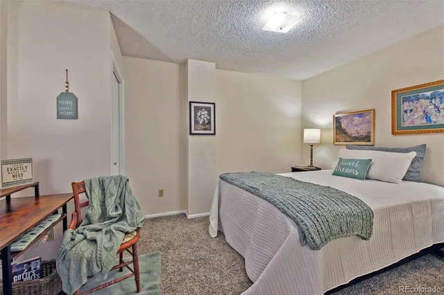a bedroom with a bed and cabinets