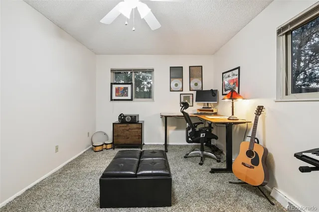 a workspace with furniture and window