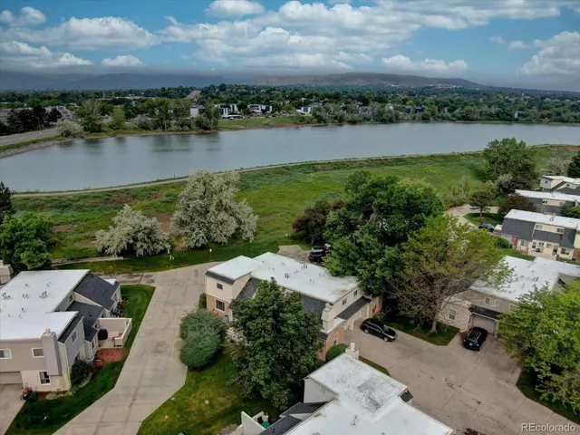 an aerial view of a city with lake view