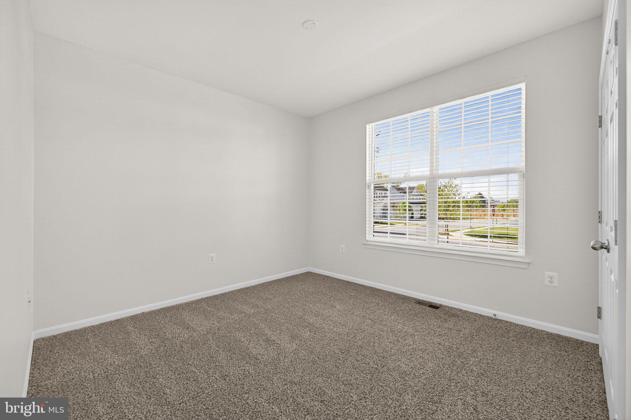 181 Sparkling Brook Road Ranson, WV 25438 - Photo 14 of 101 a view of an empty room with a window