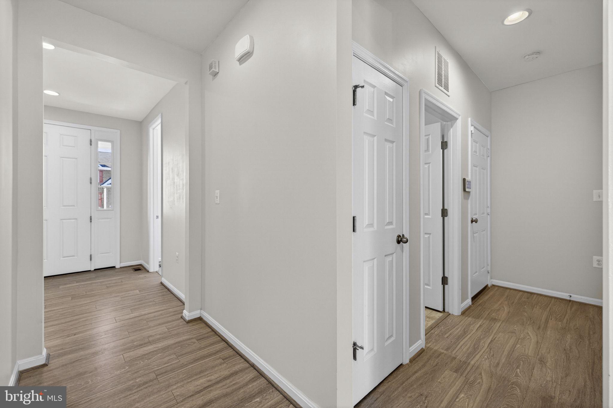 181 Sparkling Brook Road Ranson, WV 25438 - Photo 21 of 101 a view of a hallway with wooden floor