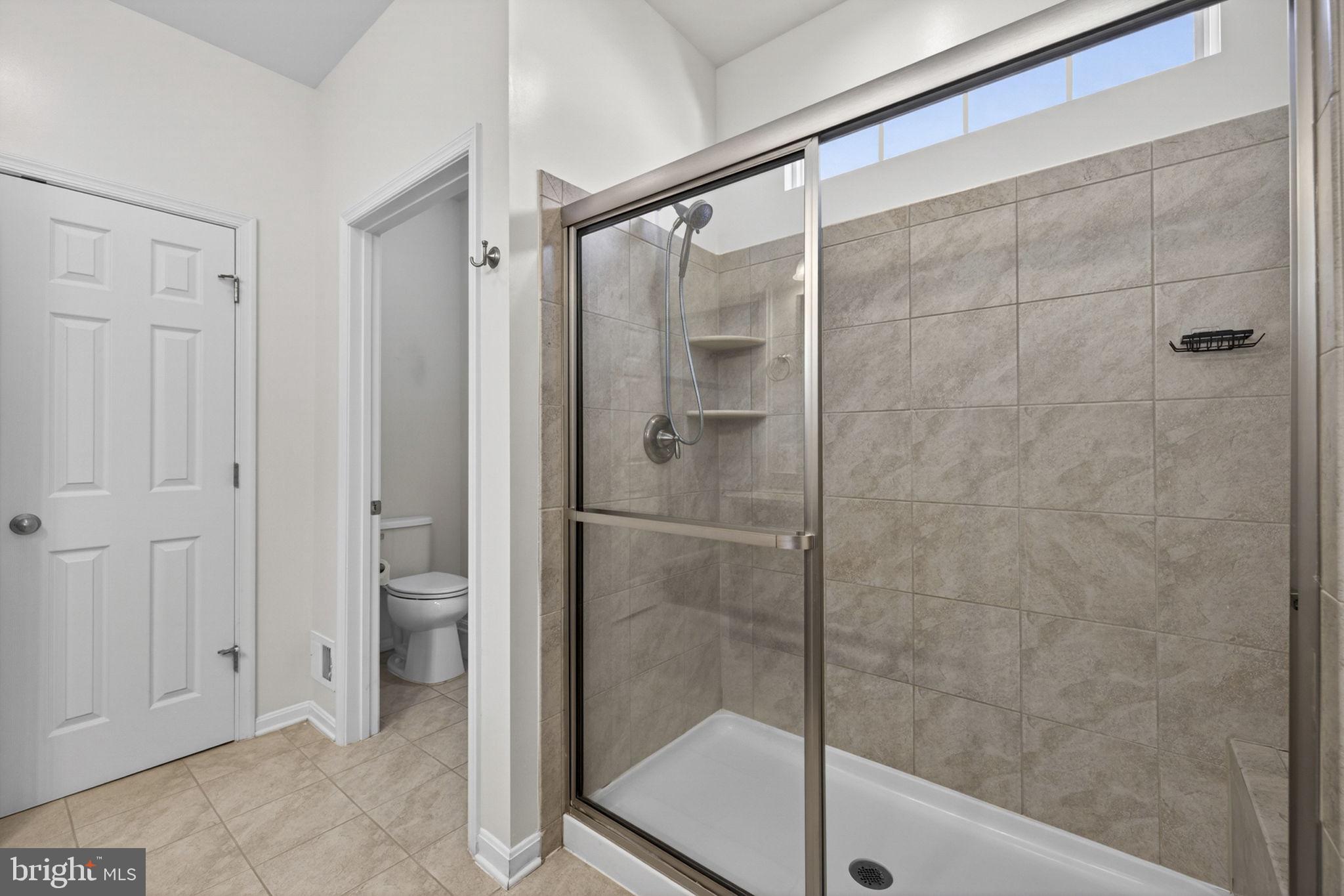 181 Sparkling Brook Road Ranson, WV 25438 - Photo 60 of 101 a bathroom with a shower and toilet