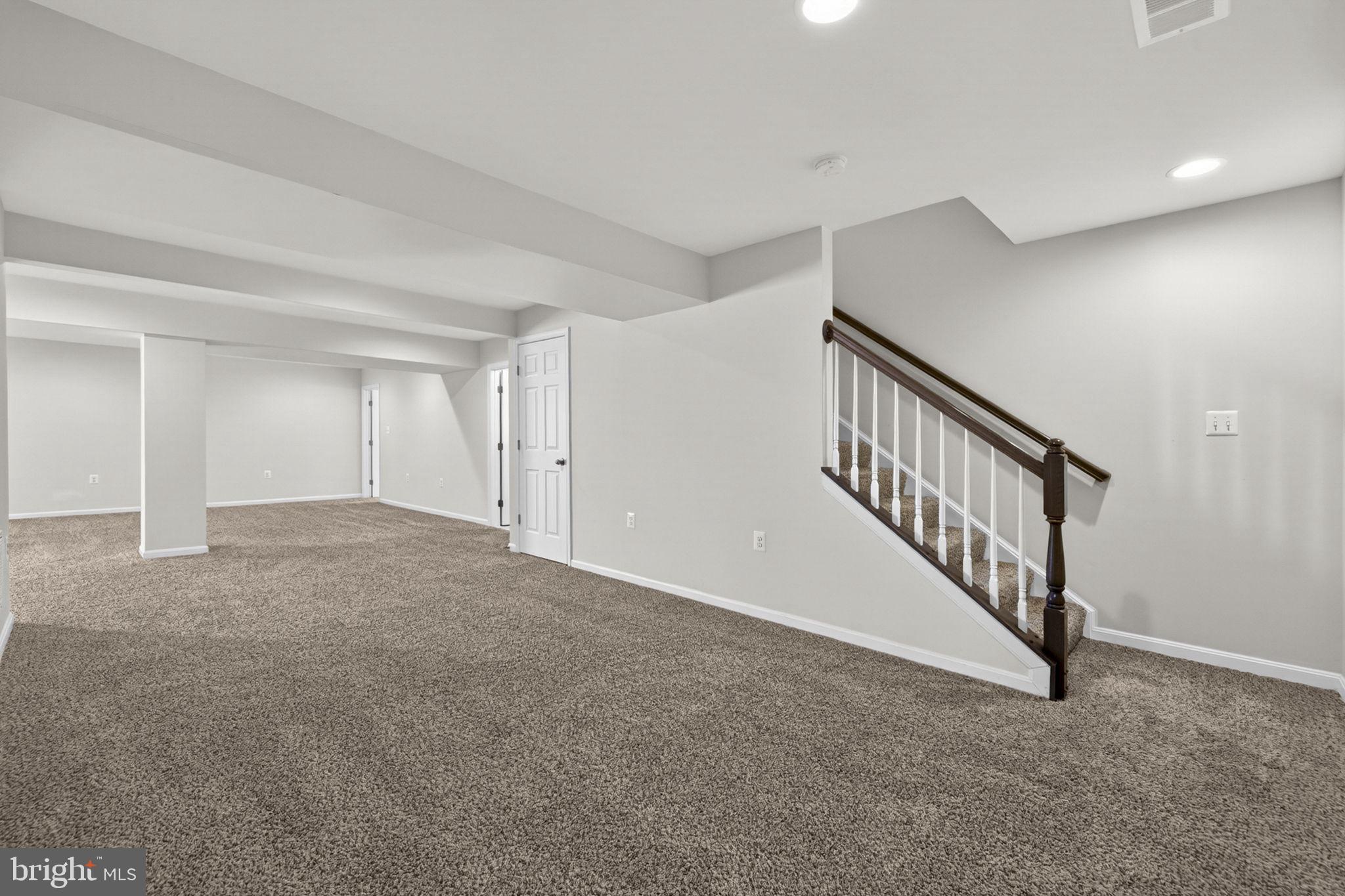 181 Sparkling Brook Road Ranson, WV 25438 - Photo 62 of 101 a view of an empty room with stairs