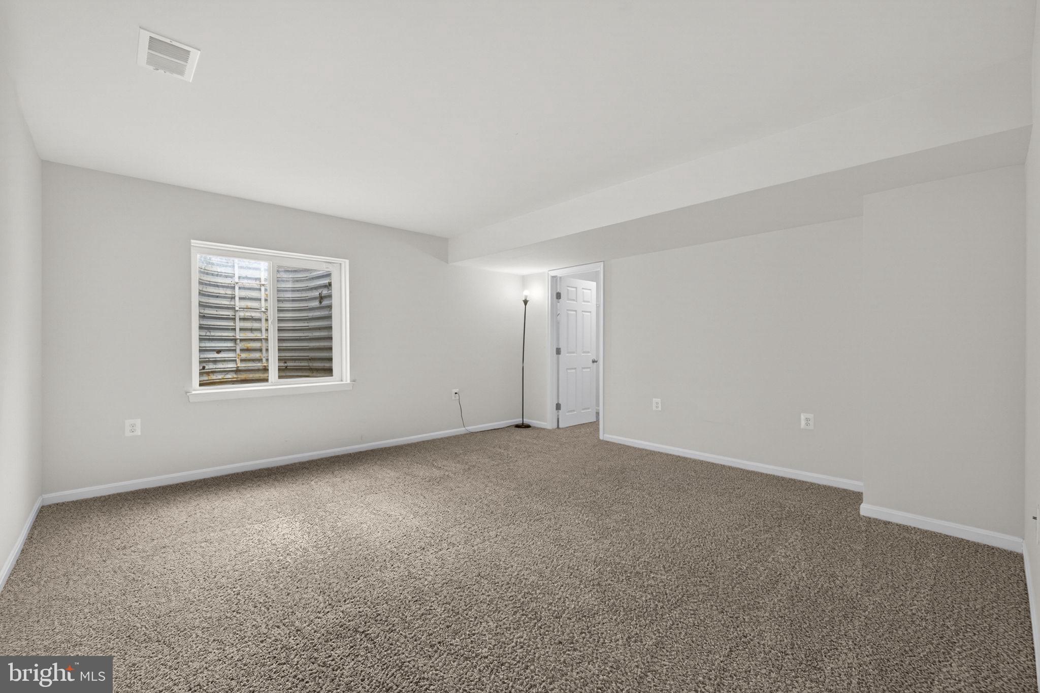 181 Sparkling Brook Road Ranson, WV 25438 - Photo 68 of 101 a view of an empty room with a window