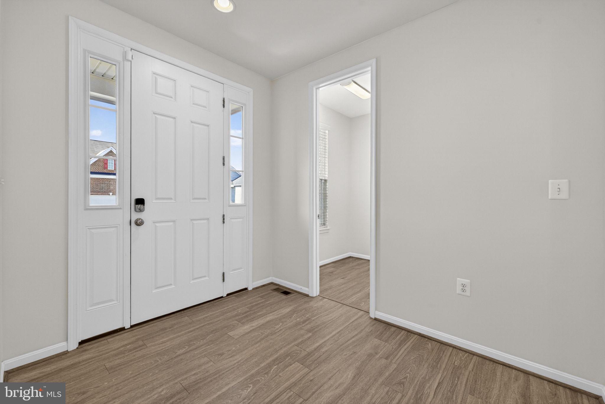 181 Sparkling Brook Road Ranson, WV 25438 - Photo 10 of 101 a view of an empty room with wooden floor