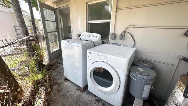 a utility room with dryer and washer