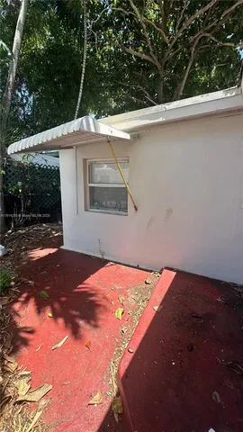 a backyard of a house with a yard and garage