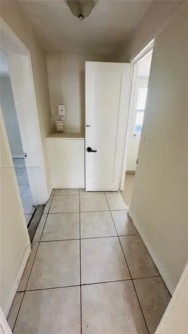 a view of an empty room and a window