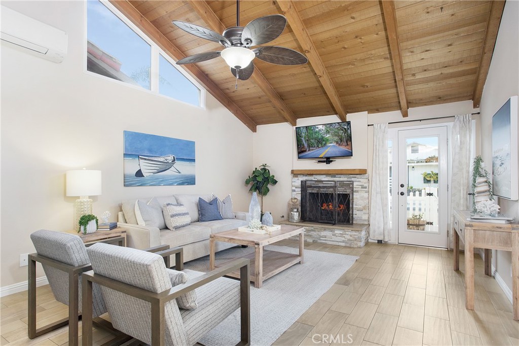 a living room with furniture a fireplace and a table