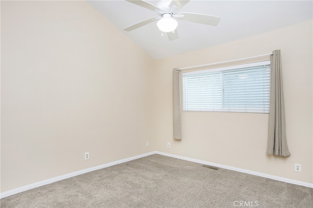 326 17th Street Seal Beach, CA 90740 - Photo 15 of 26 an empty room with a window and a fan