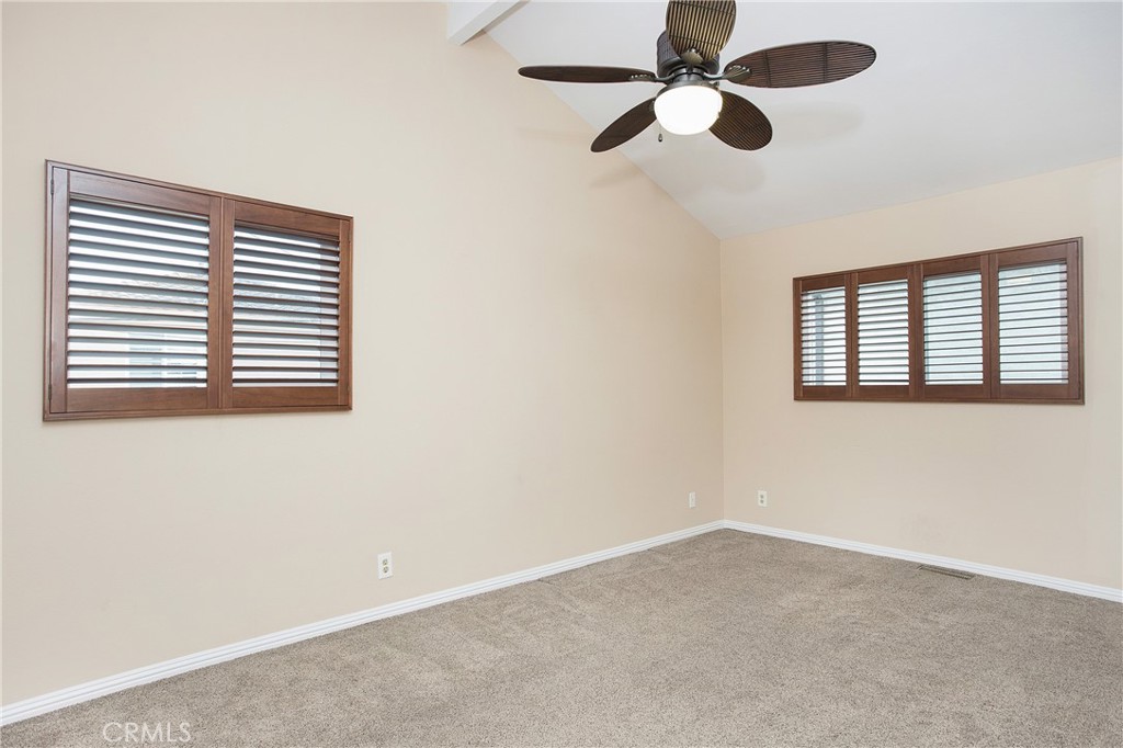 326 17th Street Seal Beach, CA 90740 - Photo 17 of 26 an empty room with a window and a ceiling fan
