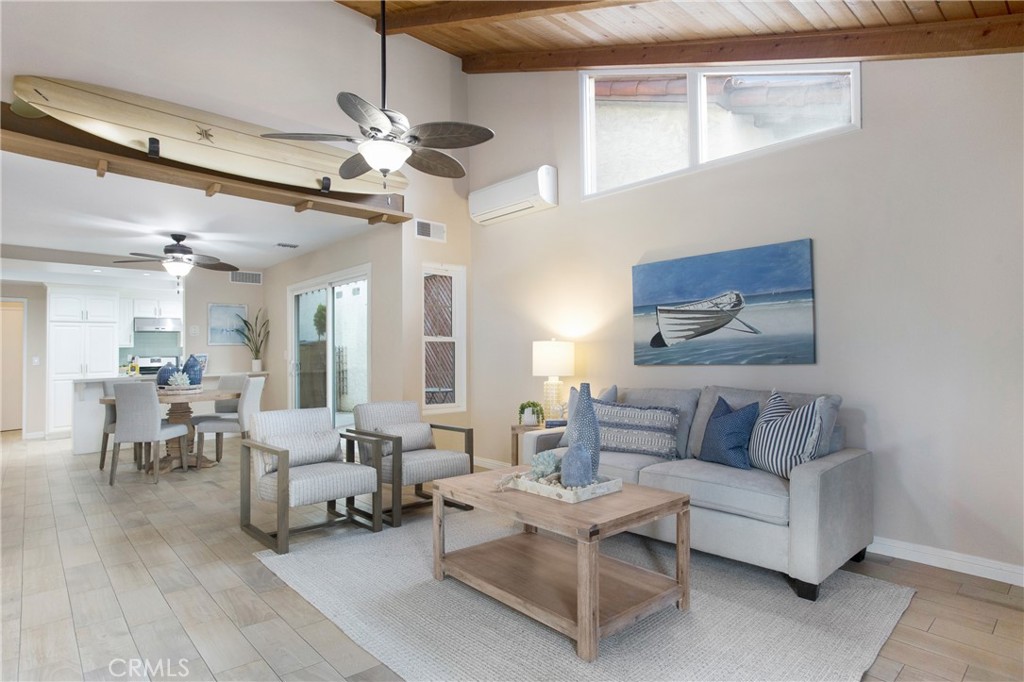 326 17th Street Seal Beach, CA 90740 - Photo 2 of 26 a living room with furniture and a chandelier