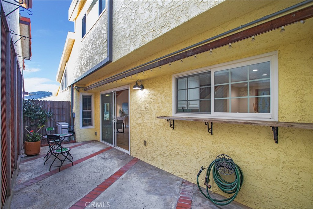 326 17th Street Seal Beach, CA 90740 - Photo 22 of 26 a front view of a house with a garden