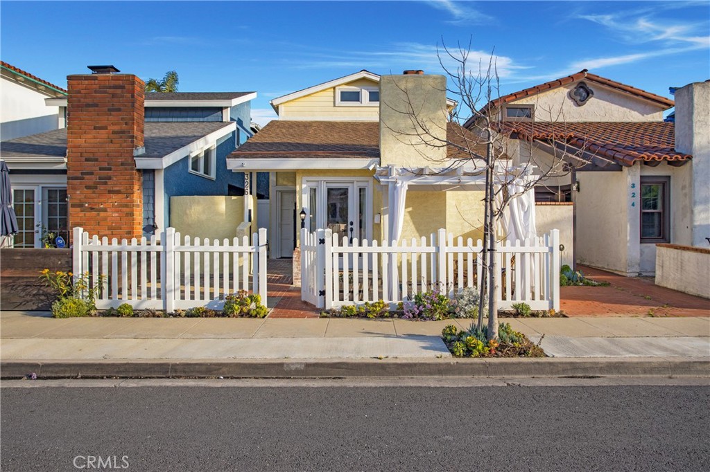 326 17th Street Seal Beach, CA 90740 - Photo 26 of 26 a front view of a house with a small yard