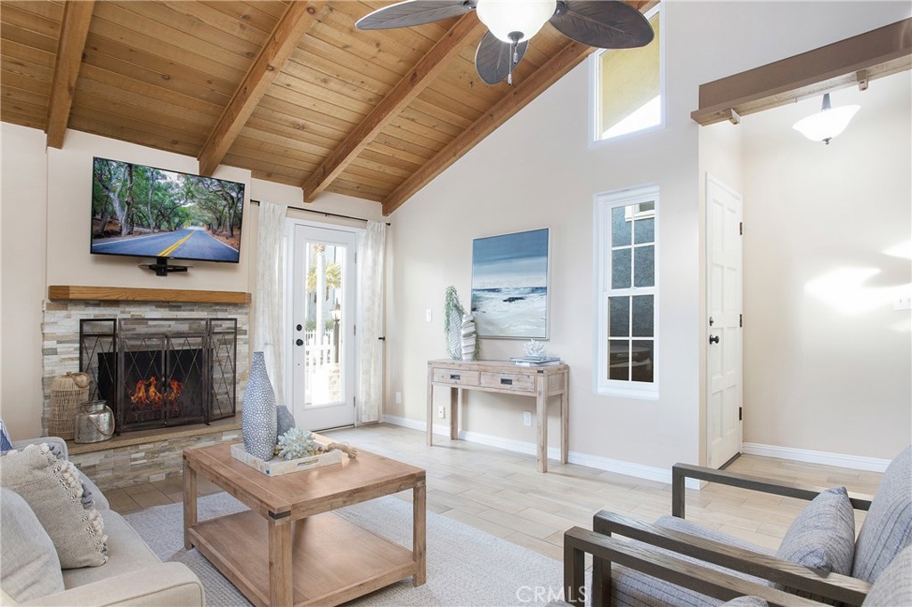 326 17th Street Seal Beach, CA 90740 - Photo 3 of 26 a living room with furniture and a fireplace