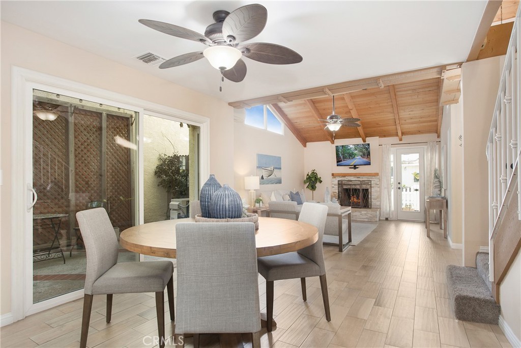 326 17th Street Seal Beach, CA 90740 - Photo 4 of 26 a dining room with furniture a chandelier and wooden floor
