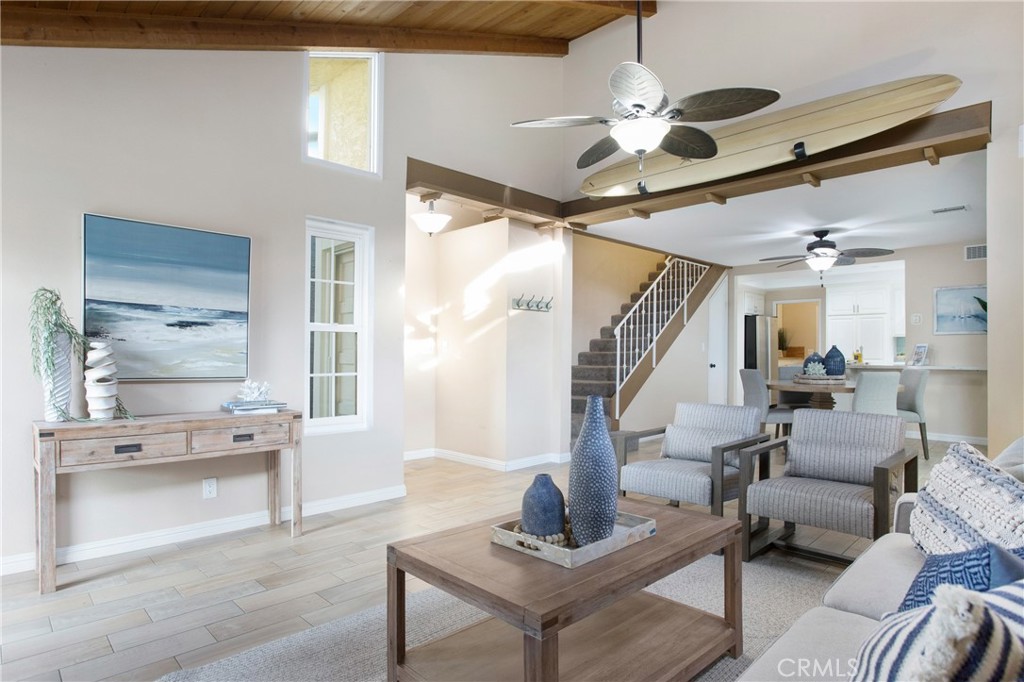 326 17th Street Seal Beach, CA 90740 - Photo 8 of 26 a living room with furniture and a chandelier