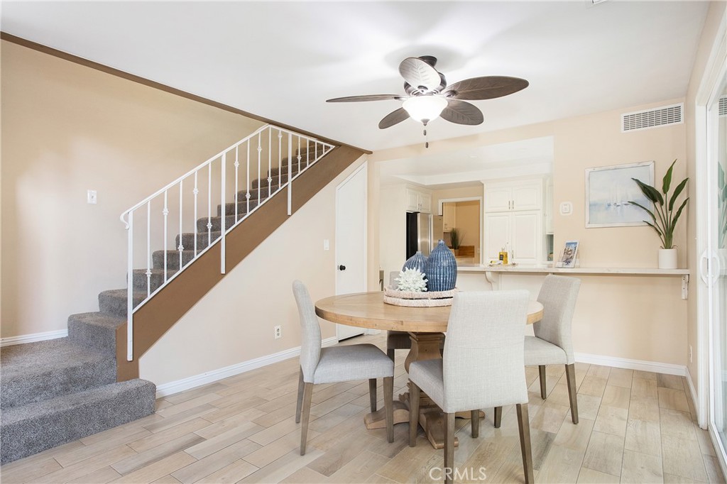 326 17th Street Seal Beach, CA 90740 - Photo 10 of 26 a view of a dining room with furniture and a chandelier