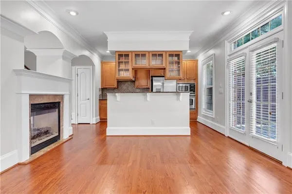 a kitchen with granite countertop a refrigerator stove and microwave