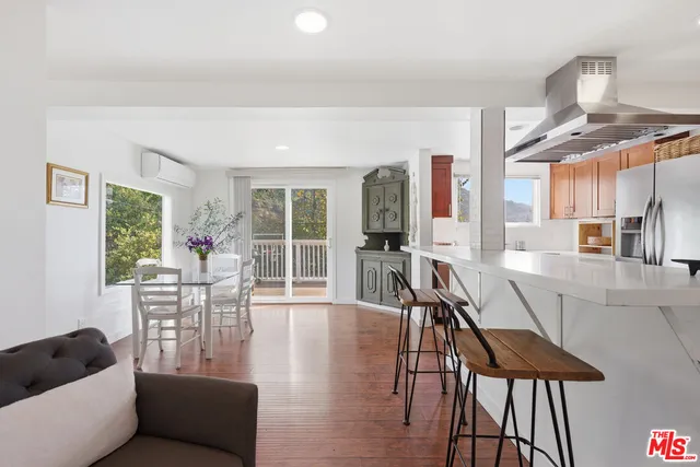 a bedroom with a large bed and a large window