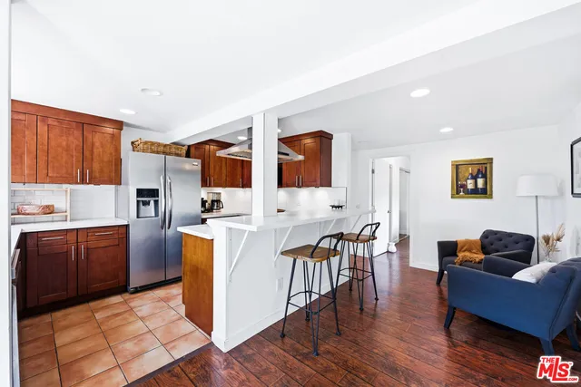 a living room with furniture and flowers