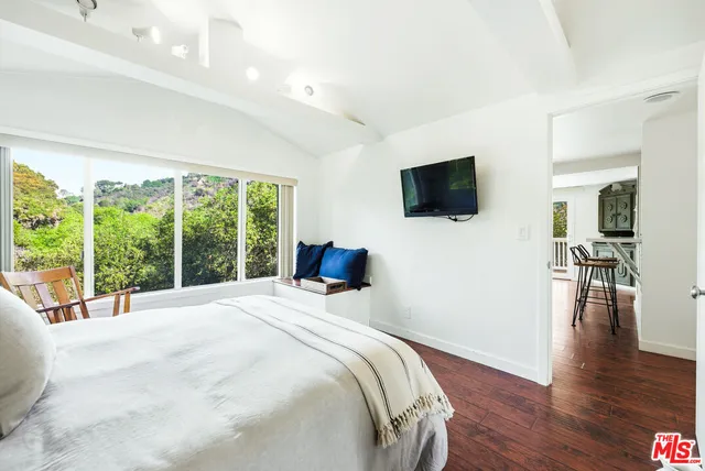a kitchen with granite countertop a sink and a window