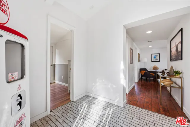 a view of a livingroom with furniture and a window