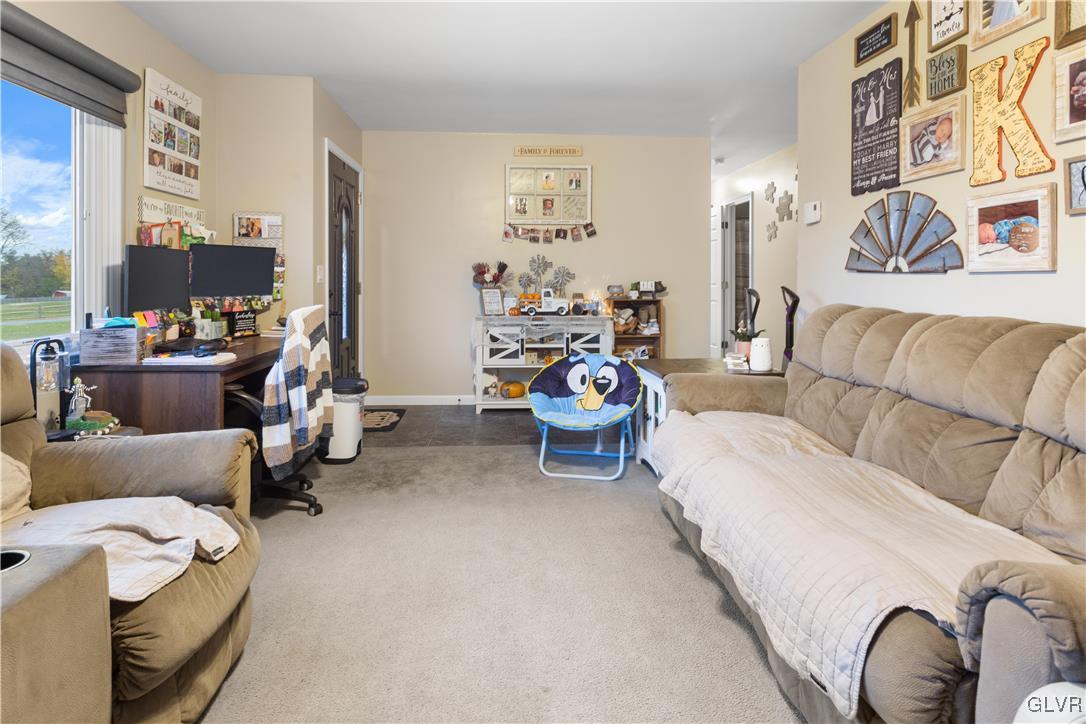 540 Church Road Bath, PA 18014 - Photo 3 of 19 a living room with furniture and a flat screen tv