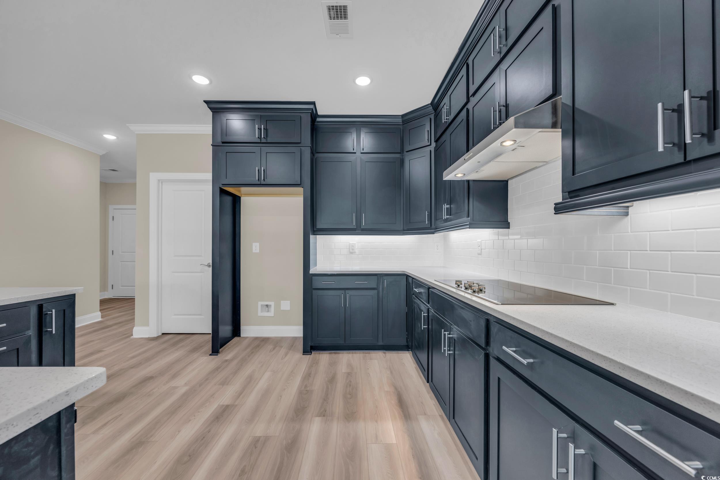 569 Beckham Court Murrells Inlet, SC 29576 - Photo 3 of 38 Kitchen featuring tasteful backsplash, ornamental