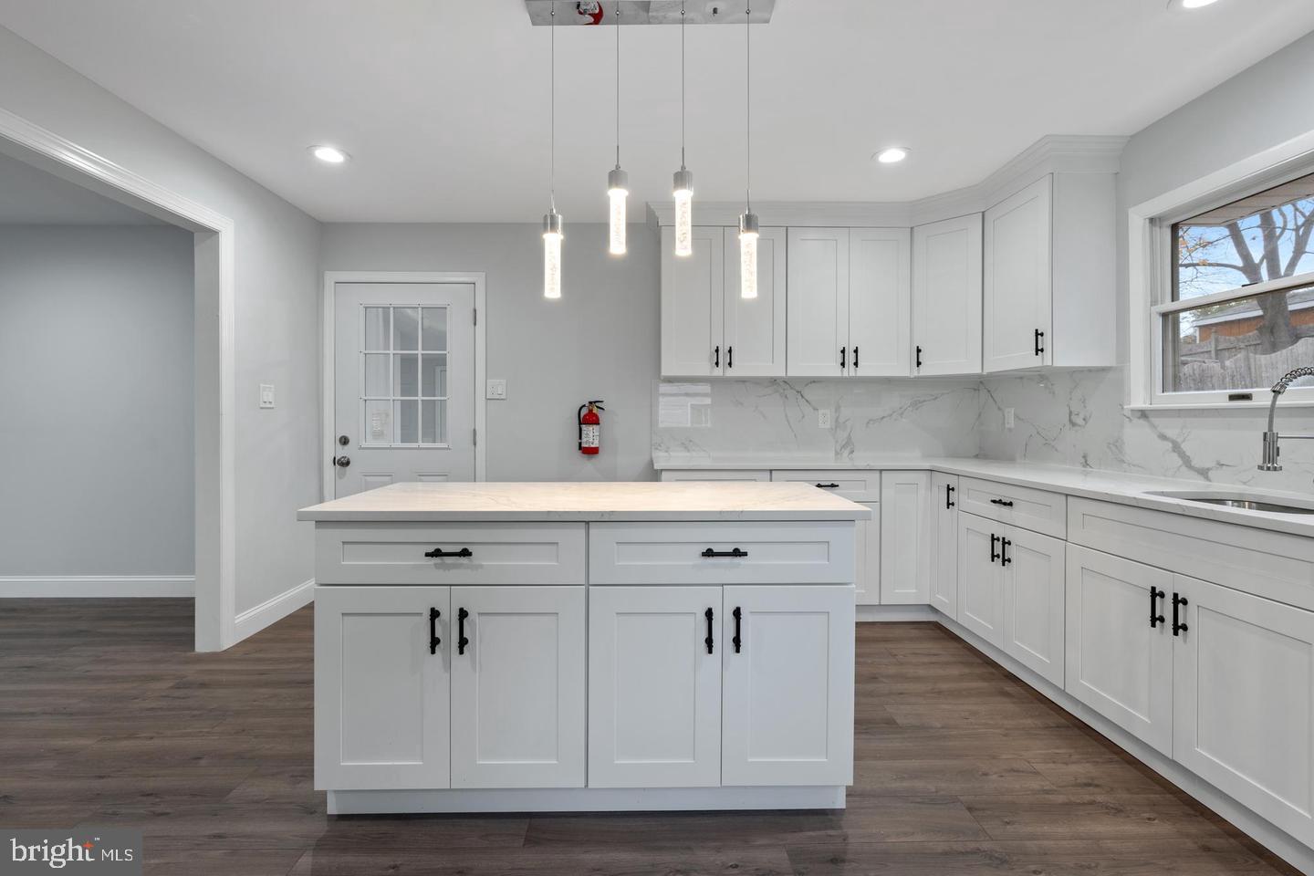 315 Ogden Sta Road Wenonah, NJ 08090 - Photo 5 of 10 a kitchen with cabinets appliances a sink and a window