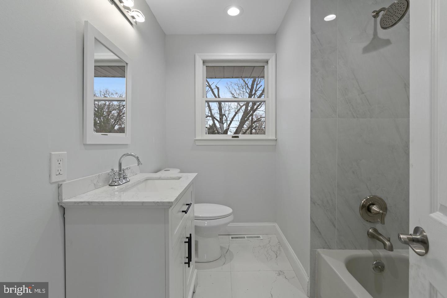 315 Ogden Sta Road Wenonah, NJ 08090 - Photo 8 of 10 a bathroom with a sink toilet and bathtub