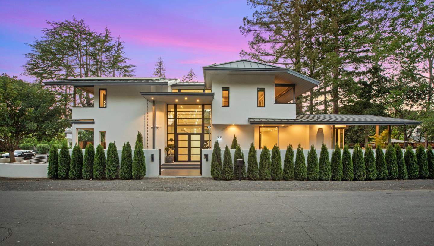 a front view of a house with garden