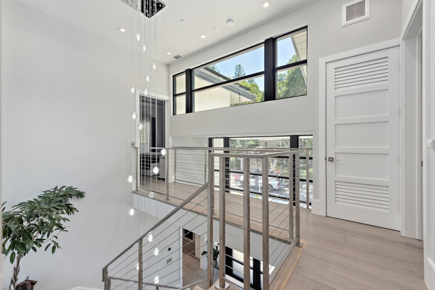 88 Park Drive Atherton, CA 94027 - Photo 14 of 40 a view of a hallway with wooden floor and staircase