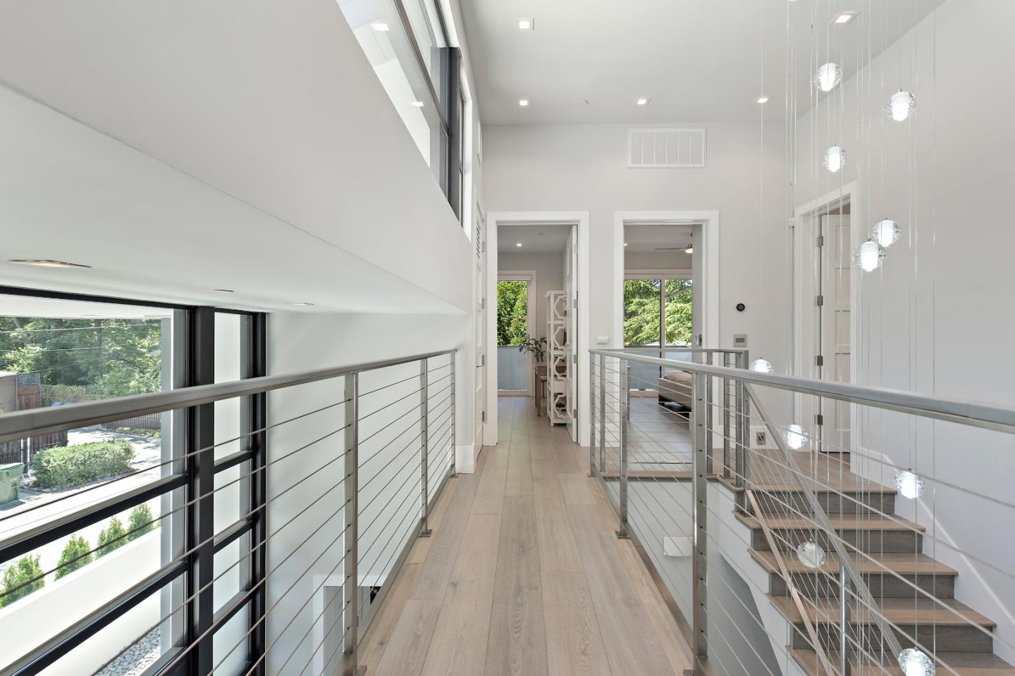 88 Park Drive Atherton, CA 94027 - Photo 15 of 40 a view of a hallway with wooden floor and staircase