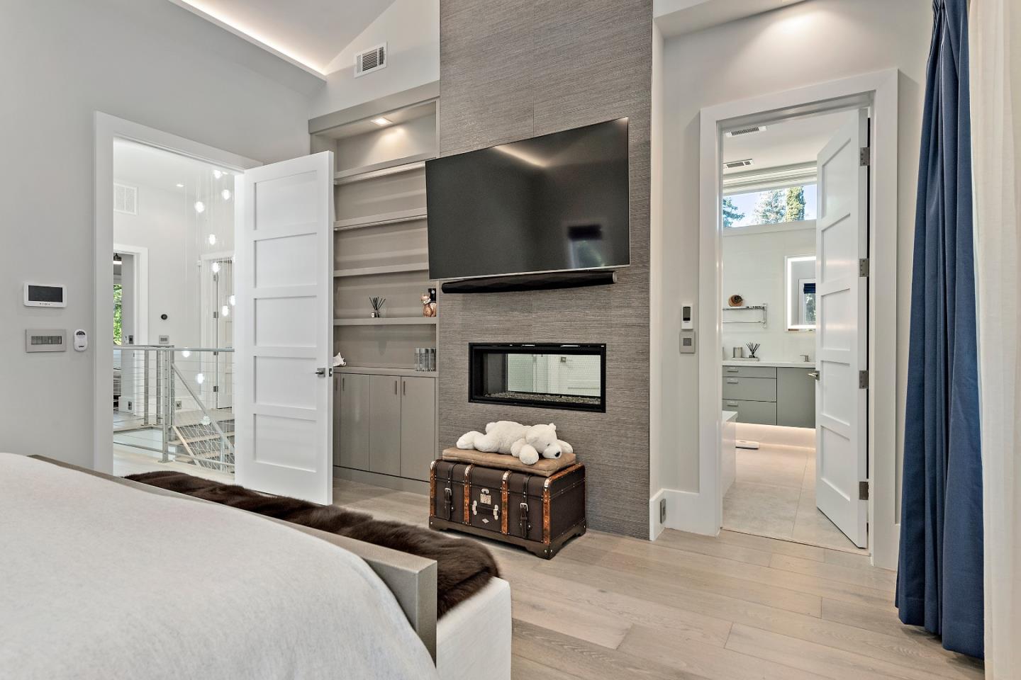 88 Park Drive Atherton, CA 94027 - Photo 16 of 40 a bedroom with a bed and a television