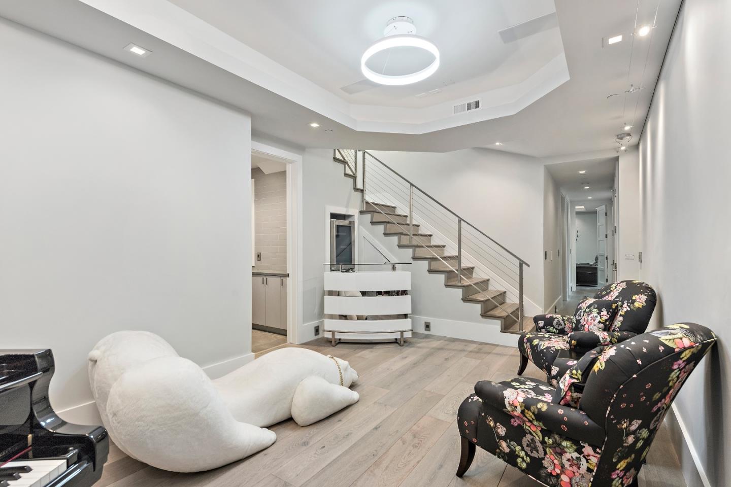 88 Park Drive Atherton, CA 94027 - Photo 26 of 40 a living room with furniture and stairs