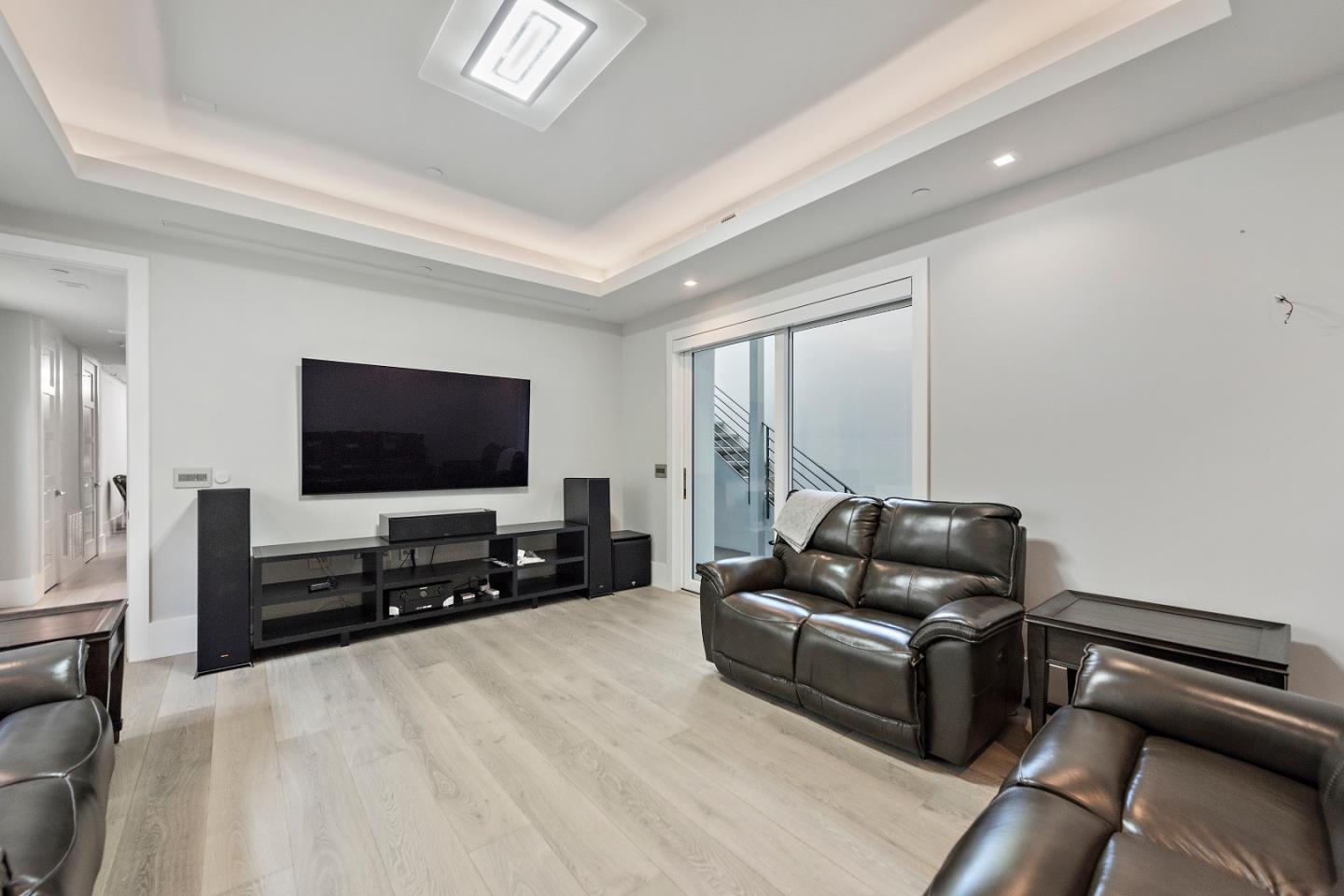 88 Park Drive Atherton, CA 94027 - Photo 28 of 40 a living room with furniture and a flat screen tv