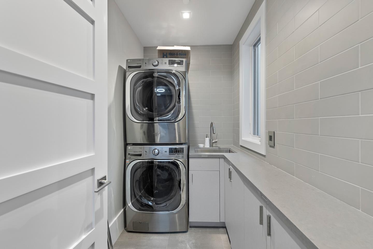 88 Park Drive Atherton, CA 94027 - Photo 31 of 40 a utility room with sink dryer and washer