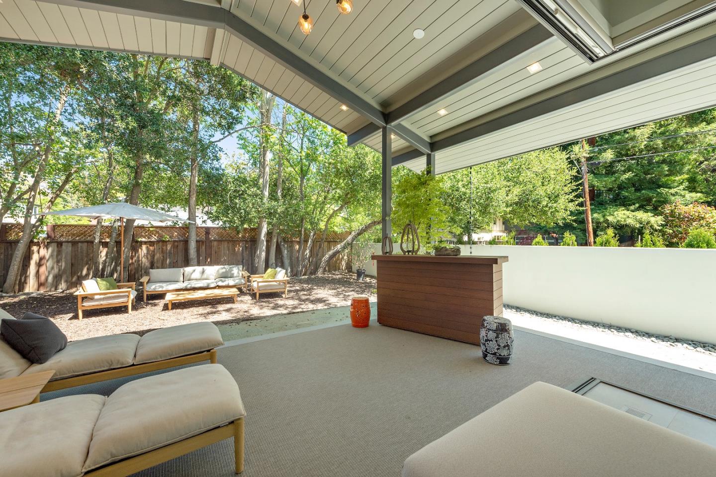 88 Park Drive Atherton, CA 94027 - Photo 33 of 40 a living room with patio furniture and a garden