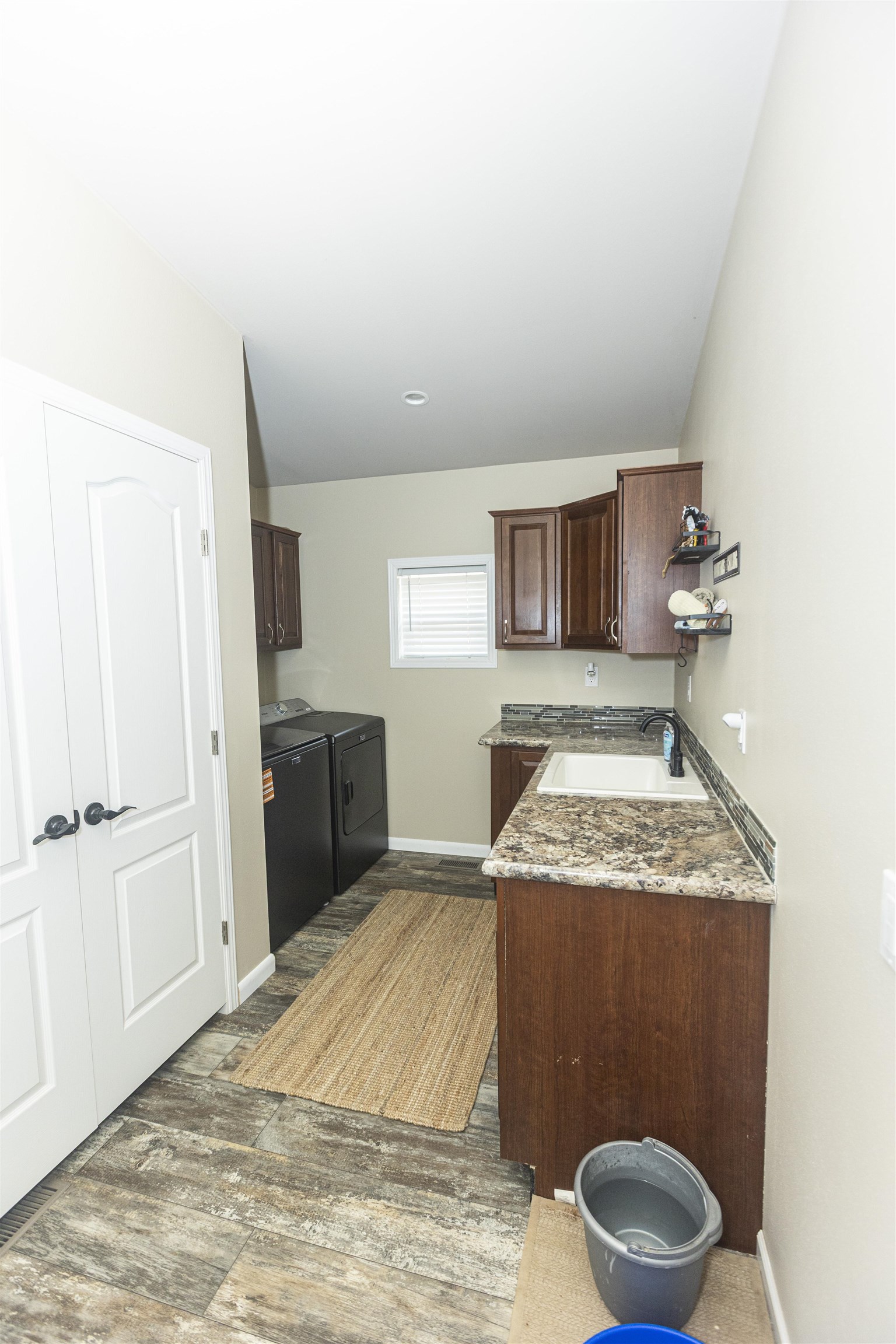 2432 Pioneer Way Rifle, CO 81650 - Photo 11 of 28 a bedroom with a granite countertop sink and mirror