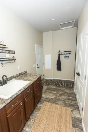 a view of a hallway to a room and a livingroom